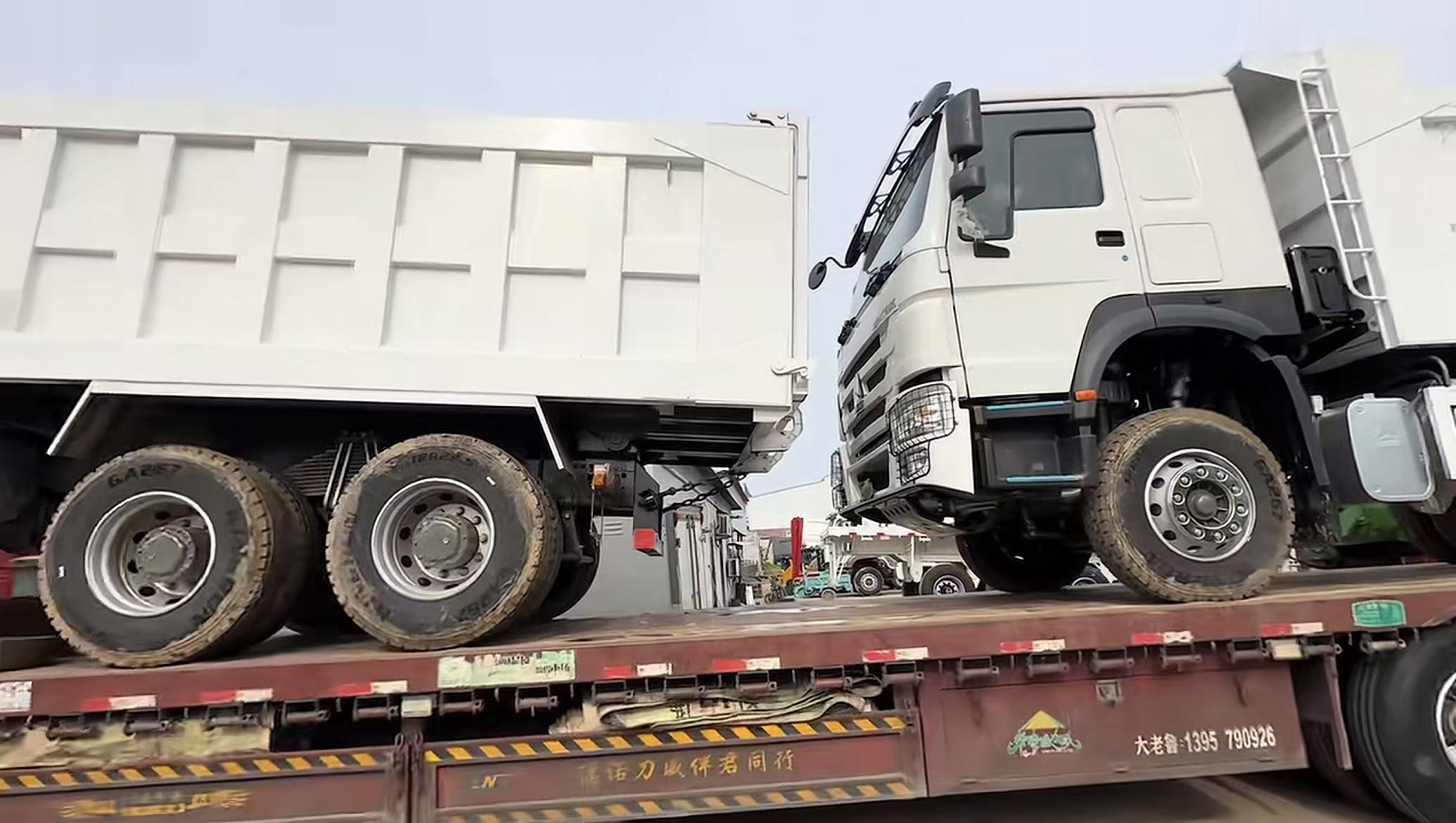 Used HOWO dump trucks loaded for export from China