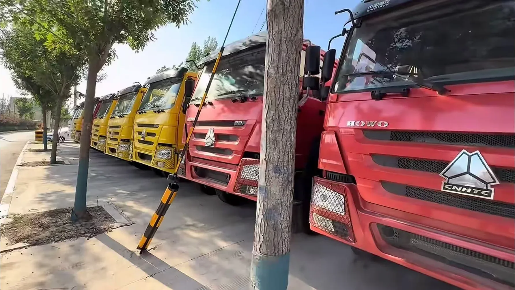 Used trucks lined up in the stock yard