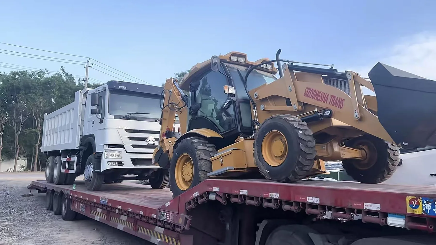 Wheel loader and dump truck loaded for delivery