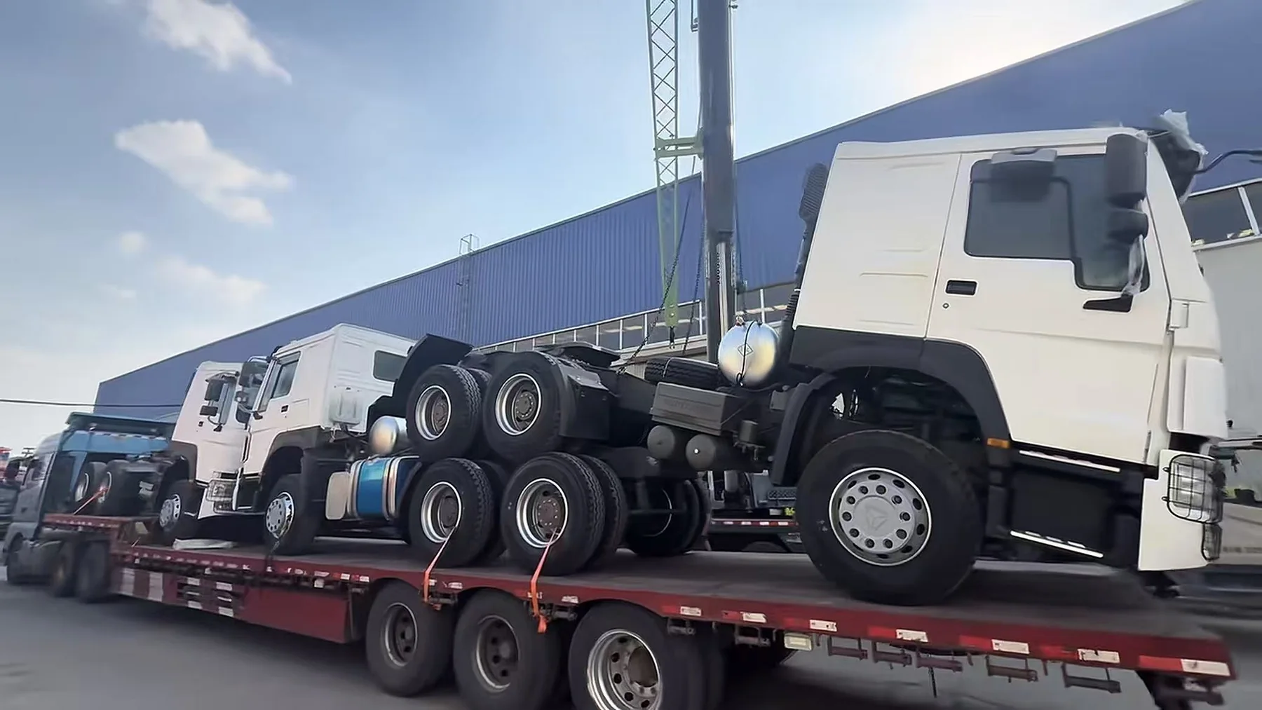 Tractor trucks loaded on a transport trailer