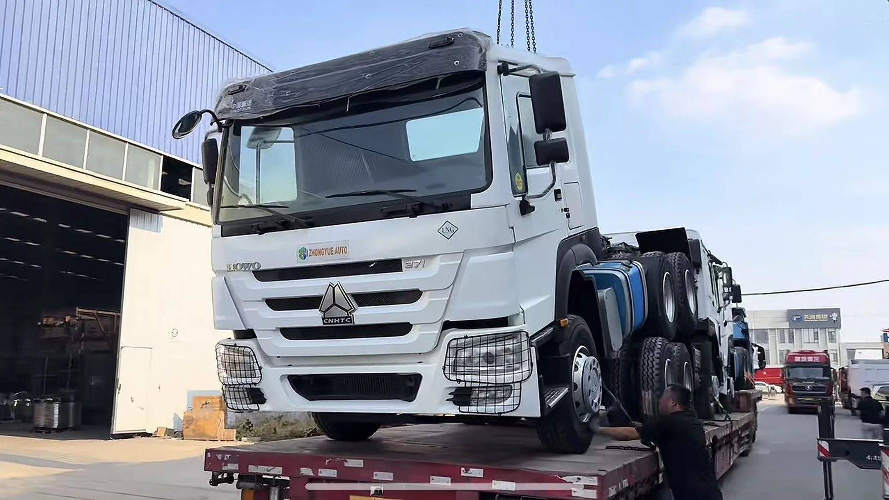Tractor truck lifted and loaded for transport
